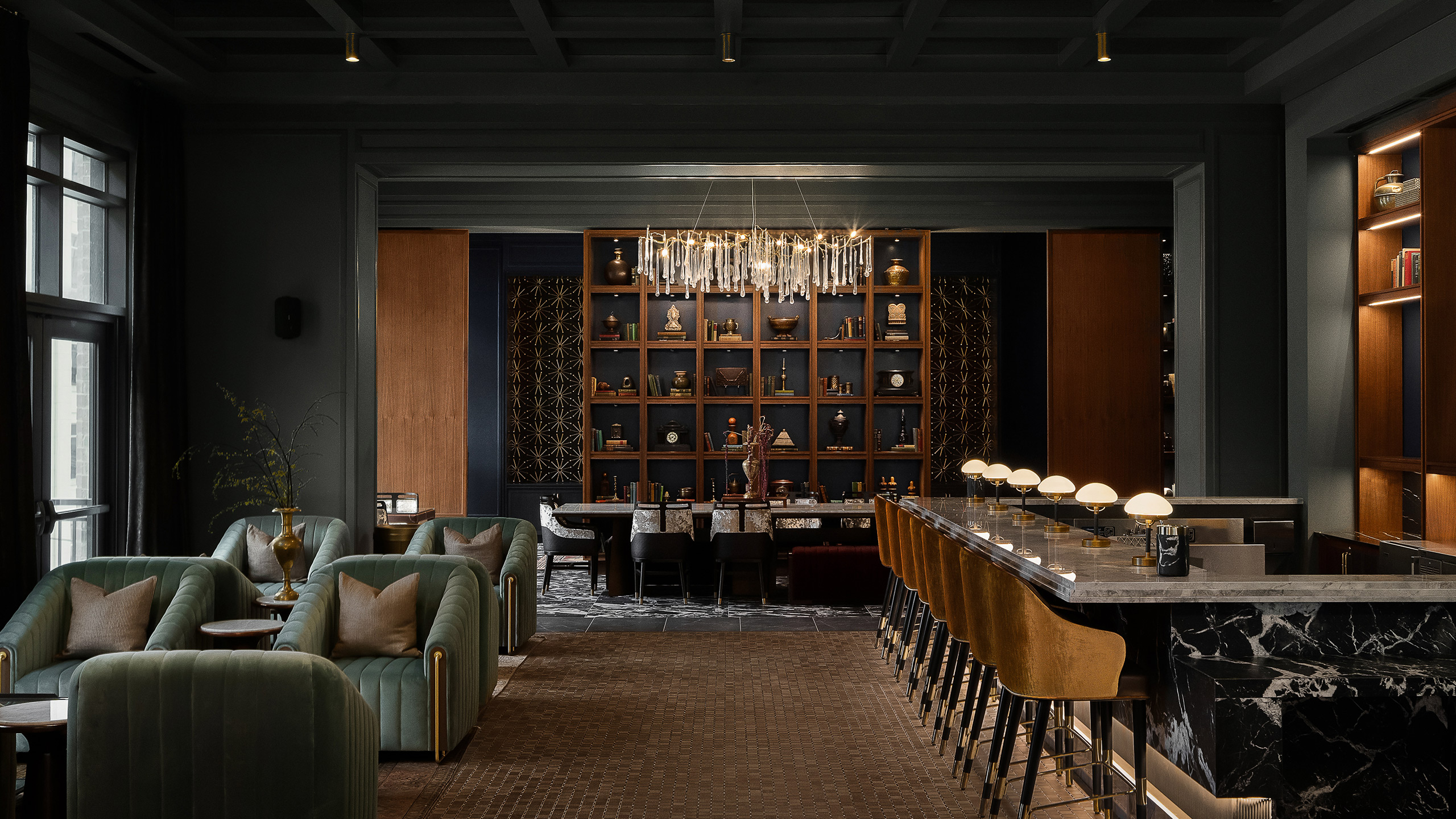 A StreetLights amenity lounge featuring a hospitality-inspired bar, layered seating, and curated millwork