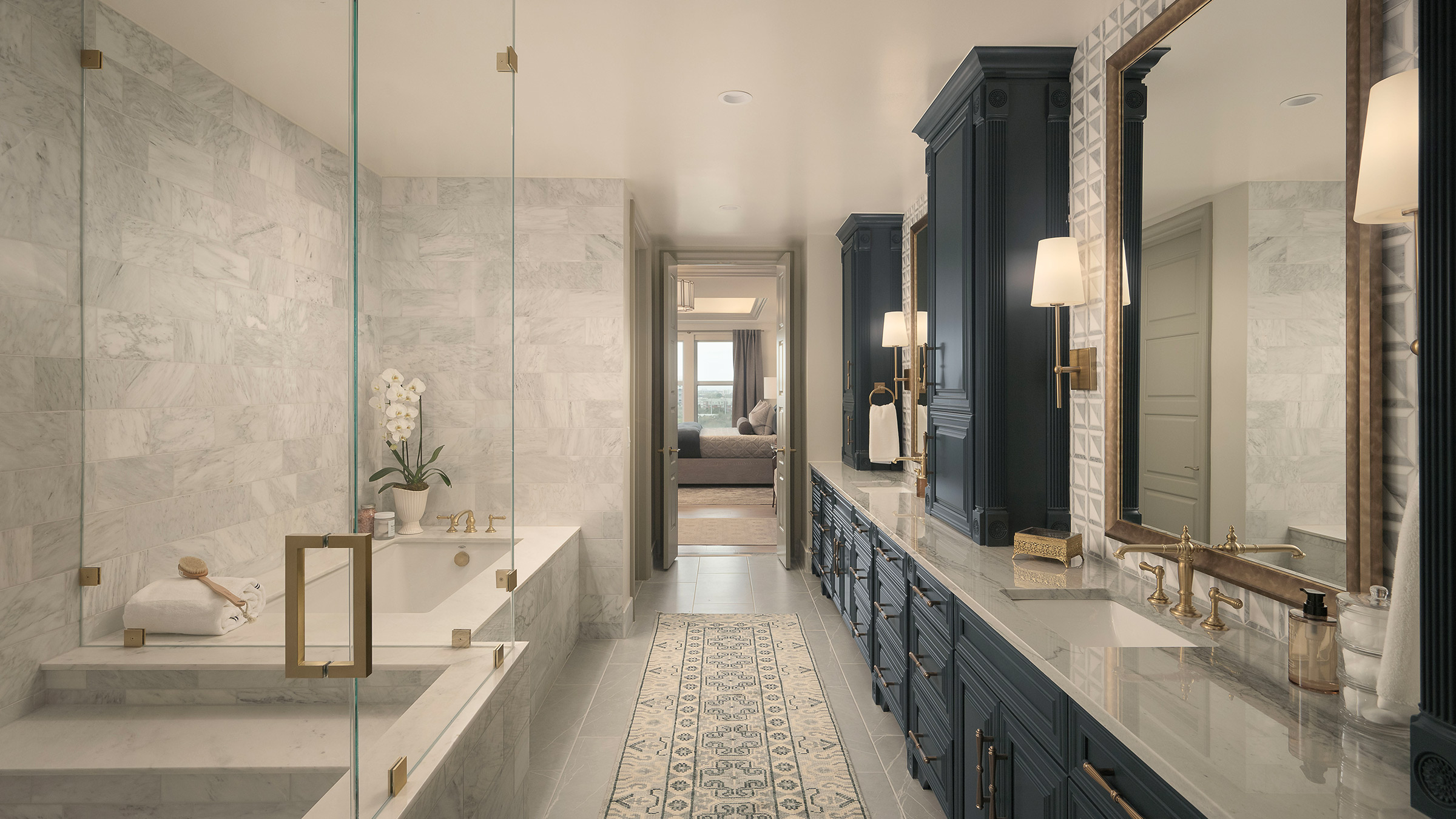 A StreetLights primary bathroom with custom millwork and finishes